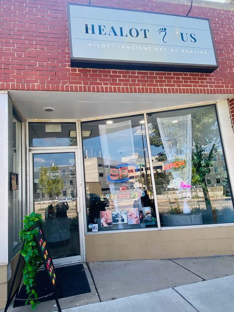 The Healot R Us storefront on Oakton Street, with its blue sign and glass door.